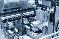 A closeup of factory automation line with automated machinery and a convyor belt system